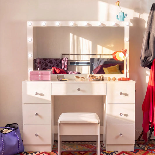 White vanity with mirror and makeup items in a room setting