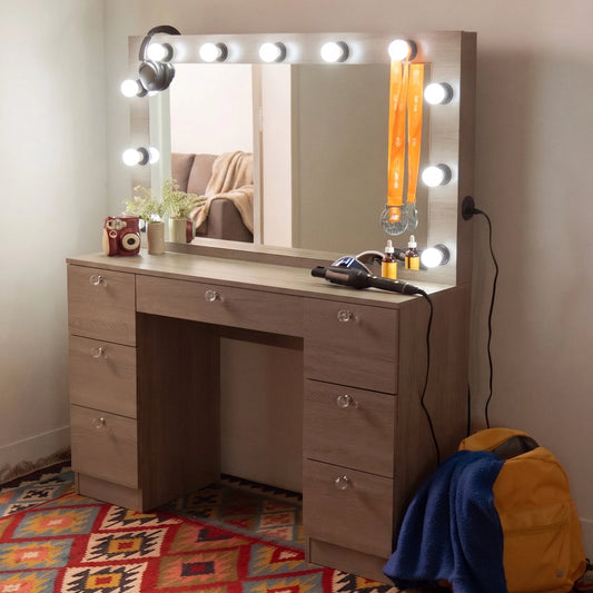 Wooden vanity with mirror and lights in a room setting